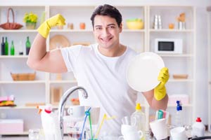 Strong man washing the dishes