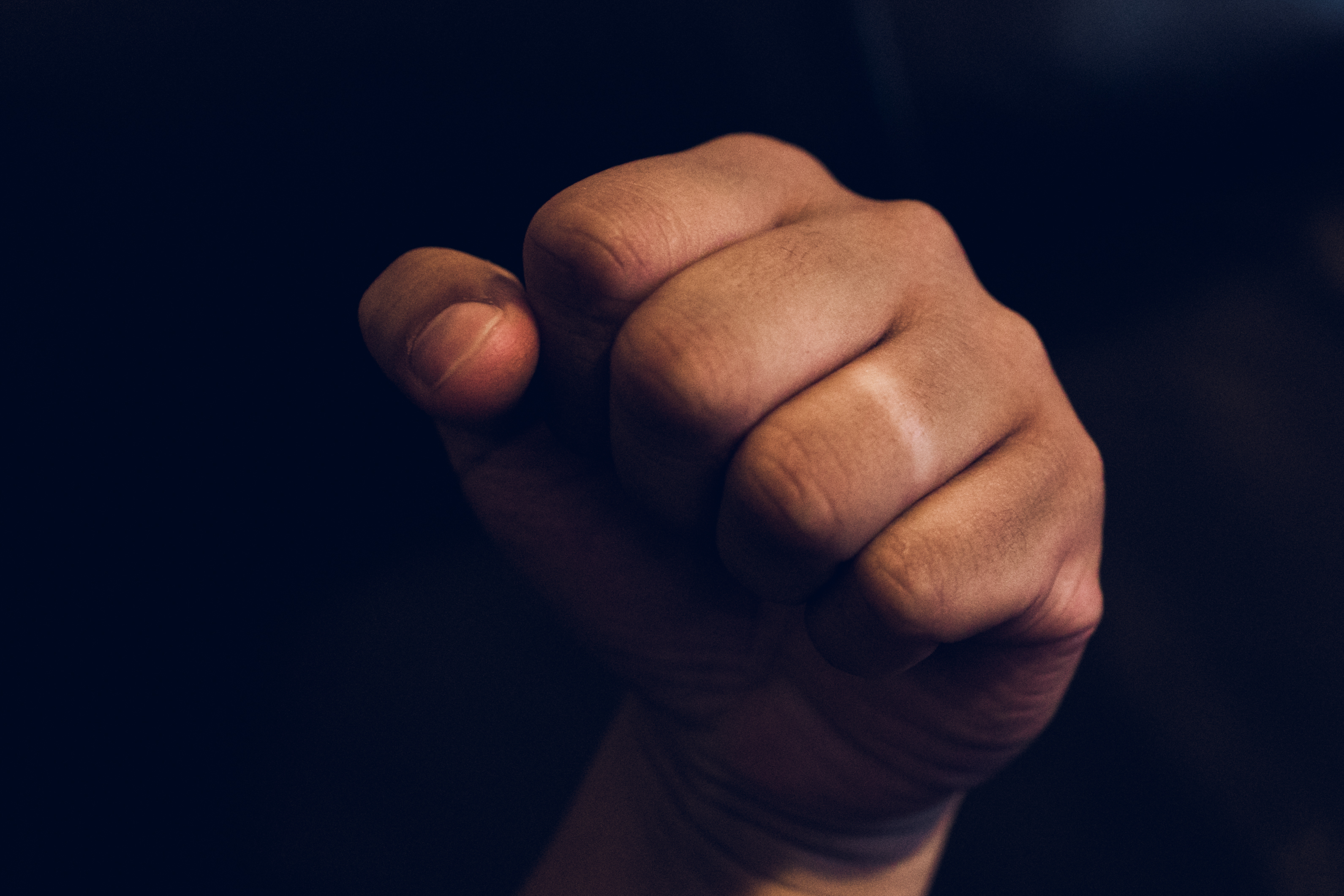 Wedding Ring Taken Off Hand in a fist without the marriage ring
